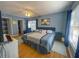 Inviting bedroom with natural light, wood flooring, and comfortable furnishings, creating a warm and welcoming space at 3367 Crystal E Ct # F, Palm Harbor, FL 34685
