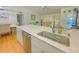Spacious kitchen island featuring a stainless steel dishwasher and sink with ample counter space and storage at 3367 Crystal E Ct # F, Palm Harbor, FL 34685