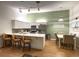 Bright kitchen featuring modern appliances, ample counter space and seating with a dining area at 3367 Crystal E Ct # F, Palm Harbor, FL 34685