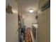 A well-organized laundry room featuring modern machines, decorative rug, and ample storage space at 3367 Crystal E Ct # F, Palm Harbor, FL 34685
