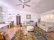 Open concept living room featuring modern furniture, neutral colors, and hardwood flooring at 3367 Crystal E Ct # F, Palm Harbor, FL 34685