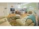 Open concept living room with updated kitchen featuring modern furniture and decor at 3367 Crystal E Ct # F, Palm Harbor, FL 34685