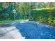 Convenient parking area with reserved parking next to a pathway, and greenery, ensuring easy access to the community at 3367 Crystal E Ct # F, Palm Harbor, FL 34685