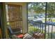 Relaxing screened patio with comfortable seating overlooking a lush landscape, perfect for outdoor enjoyment at 3367 Crystal E Ct # F, Palm Harbor, FL 34685