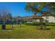 Community picnic area with tables, grills and gazebo near a lake, perfect for outdoor entertaining at 3367 Crystal E Ct # F, Palm Harbor, FL 34685