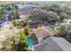Overhead view of a home featuring a sparkling pool and lush landscaping, nestled in a friendly neighborhood at 3900 W Platt St, Tampa, FL 33609