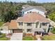 Lovely home with a well-maintained lawn, charming shutters, and an attached garage at 3900 W Platt St, Tampa, FL 33609