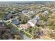 An aerial perspective of a home nestled in a leafy neighborhood, showcasing its curb appeal at 3900 W Platt St, Tampa, FL 33609