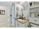 Bright bathroom featuring tile flooring, a granite vanity, and decorative fixtures at 3900 W Platt St, Tampa, FL 33609