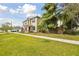 Charming two-story home features lush landscaping and a welcoming front porch at 3900 W Platt St, Tampa, FL 33609