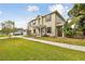 Charming two-story home features a welcoming front porch and a well-manicured lawn at 3900 W Platt St, Tampa, FL 33609