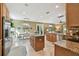 Spacious kitchen with an island, stainless steel appliances, and an adjacent dining area at 3900 W Platt St, Tampa, FL 33609
