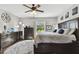 Well-lit main bedroom with plush rug and a large window with backyard views at 3900 W Platt St, Tampa, FL 33609
