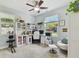 Airy office with natural light, built-in desk and storage, and a comfortable seating area for visitors at 3900 W Platt St, Tampa, FL 33609