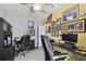 The office has dual workstations and walls decorated with sports memorabilia and a comfortable office chair at 3900 W Platt St, Tampa, FL 33609