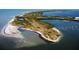 An aerial view of the property with a serene landscape surrounded by beautiful waters at 417 Tennessee Ave, Crystal Beach, FL 34681