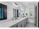 Modern bathroom with double vanity, quartz countertop, and sleek fixtures at 417 Tennessee Ave, Crystal Beach, FL 34681