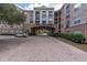 An attractive multi-story residential building features stone accents and manicured landscaping at 4221 W Spruce St # 1407, Tampa, FL 33607