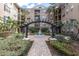 Beautiful courtyard featuring a fountain, lush landscaping, and an elegant pergola at 4221 W Spruce St # 1407, Tampa, FL 33607