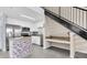 Bright kitchen featuring stainless steel appliances, white cabinetry, a stylish backsplash and a breakfast bar at 4221 W Spruce St # 1407, Tampa, FL 33607