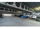 The parking garage features a high ceiling and clearly defined parking spots at 4221 W Spruce St # 1407, Tampa, FL 33607