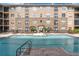 The apartment complex has a refreshing outdoor swimming pool and lounge area at 4221 W Spruce St # 1407, Tampa, FL 33607