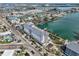 Breathtaking aerial shot showcasing the building's waterfront location with docks, surrounding scenery, and coastal charm at 445 Hamden Dr # 201, Clearwater Beach, FL 33767