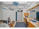 Bright bathroom with dual sinks, large mirror, nautical theme, and decorative compass at 4677 Aylesford Dr, Palm Harbor, FL 34685