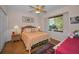 Bedroom with wood floors, large window and cozy decor at 4677 Aylesford Dr, Palm Harbor, FL 34685