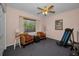 Bedroom featuring comfy chairs, natural light, and an exercise machine at 4677 Aylesford Dr, Palm Harbor, FL 34685