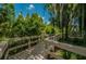 The boardwalk goes through a heavily wooded area at 4677 Aylesford Dr, Palm Harbor, FL 34685