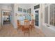 Cozy breakfast nook with a table and chairs surrounded by windows and natural light at 4677 Aylesford Dr, Palm Harbor, FL 34685
