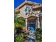 Close exterior shot emphasizing the front entrance with its blue double doors and decorative design elements at 4677 Aylesford Dr, Palm Harbor, FL 34685