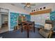 Comfortable home office with built-in shelves, creative wall décor, and accent lighting at 4677 Aylesford Dr, Palm Harbor, FL 34685