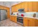 Well-equipped kitchen with stainless steel appliances, bright countertops, and ample cabinetry at 4677 Aylesford Dr, Palm Harbor, FL 34685