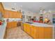 Open concept kitchen with a large island, stainless steel appliances, and plenty of cabinets at 4677 Aylesford Dr, Palm Harbor, FL 34685