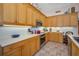 Well-equipped kitchen with stainless steel appliances, bright countertops, and ample cabinetry at 4677 Aylesford Dr, Palm Harbor, FL 34685