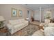 Warm and inviting living room featuring tile flooring, neutral tones, and elegant furnishings at 4677 Aylesford Dr, Palm Harbor, FL 34685