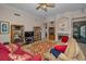 Spacious living room featuring fireplace, built-ins, and plush seating arrangement at 4677 Aylesford Dr, Palm Harbor, FL 34685