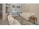 Relaxing living area featuring tile flooring, bright windows, and comfortable seating arrangements at 4677 Aylesford Dr, Palm Harbor, FL 34685