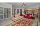 Open-concept living room showcases a seamless flow into kitchen, and outdoor view at 4677 Aylesford Dr, Palm Harbor, FL 34685