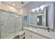 Modern bathroom with a marble tile shower, sleek vanity, and contemporary fixtures at 47 Adalia Ave, Tampa, FL 33606