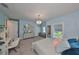 Bright bedroom with a chandelier, study desk, and cozy furnishings at 47 Adalia Ave, Tampa, FL 33606