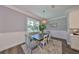 Dining area features an ornate chandelier, decorative rug, and lots of natural light at 47 Adalia Ave, Tampa, FL 33606