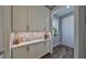 Hallway with built-in cabinetry and marble backsplash, offering stylish storage at 47 Adalia Ave, Tampa, FL 33606