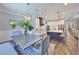 Open concept kitchen and dining room featuring a center island and stainless steel appliances at 47 Adalia Ave, Tampa, FL 33606