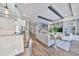 Open concept kitchen and living room. Wood flooring and many built-in features throughout the space at 47 Adalia Ave, Tampa, FL 33606
