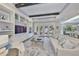 Bright living room with built-in shelving, recessed lighting and an area rug at 47 Adalia Ave, Tampa, FL 33606