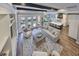 Living room with backyard view through french doors, open to kitchen and dining areas at 47 Adalia Ave, Tampa, FL 33606