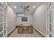 Bright office space with hardwood floors, ceiling fan, and French doors for privacy at 47 Adalia Ave, Tampa, FL 33606